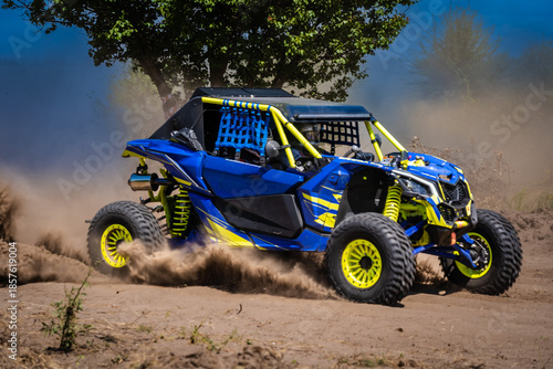 UTV kicking up sand on a dune. Extreme. 4x4.