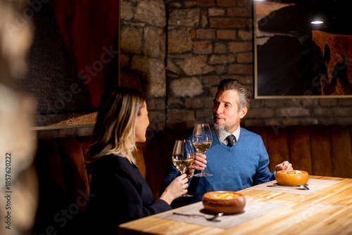 Couple shares a toast at a ...