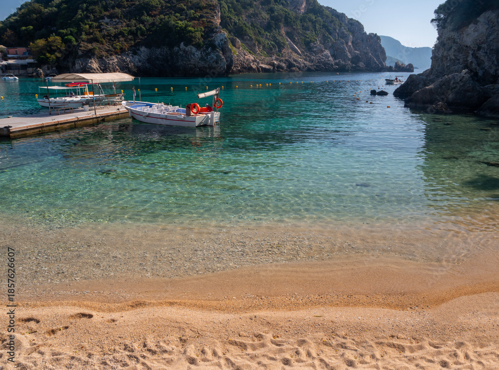 Obraz premium Panoramic view of the resort town of Paleokastritsa, sea and the cliffs of the Ionian Sea in Corfu, Greece