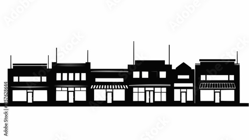 Silhouette of a row of old western town buildings.
