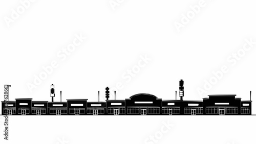 Silhouette of a shopping center with multiple stores and parking.