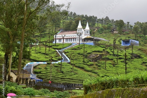 Hilltop Karumalai Velankanni Church nestled in vibrant tea gardens of Valparai, Tamil Nadu, highlighting calm spirituality and scenic travel destination
