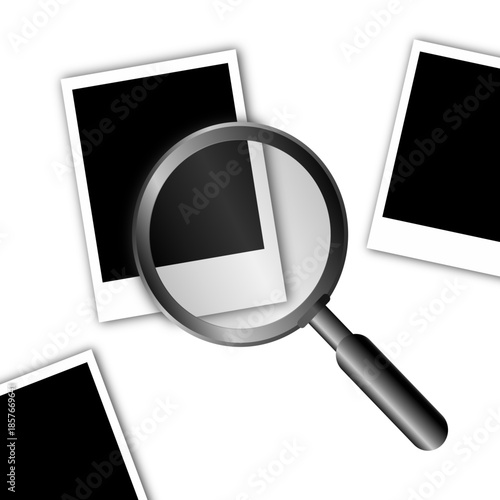 Magnifying glass on blank photo frames. Magnifier on scattered photo frames, memories concept.