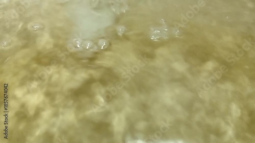 Abstract Water Surface Texture with Natural Light Reflection