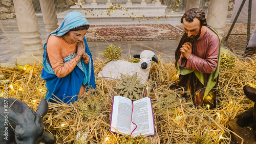 A traditional Christmas nativity scene (creche) and festive decorations 