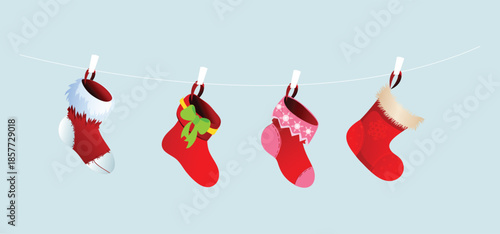 Four christmas stockings hanging from a line