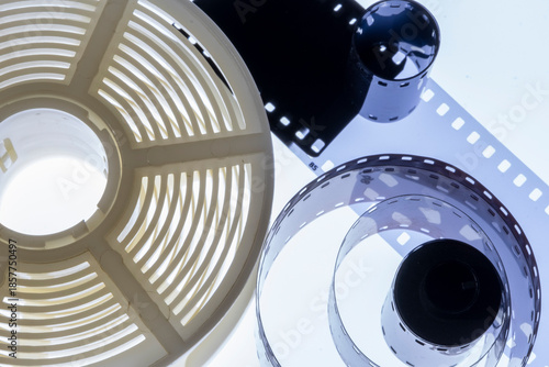 Film strip template with three blank or empty frames, developed 135 type or 35mm film placeholder on white, real film grain