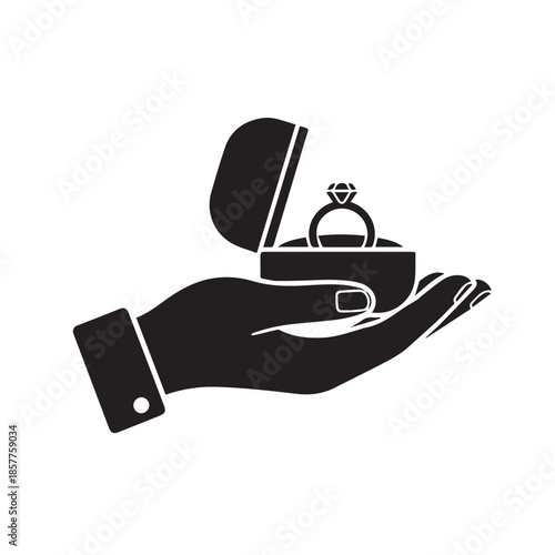 A silhouette of a hand presenting an open ring box containing a valuable diamond ring.