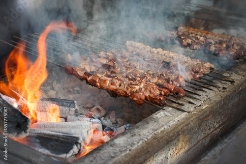 Grilled spiced ground beef and shish kebab over charcoal fire.