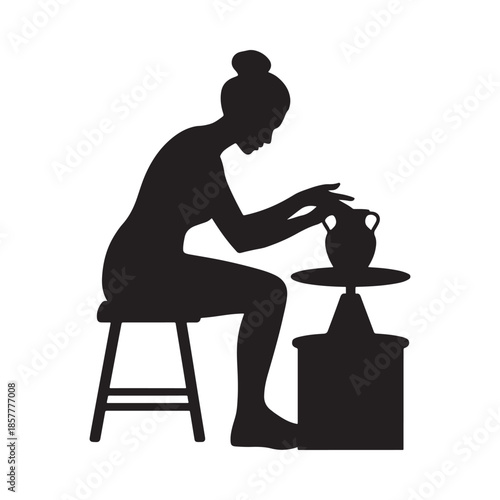 Silhouette of a woman intently working at a pottery wheel crafting a vessel with dedication