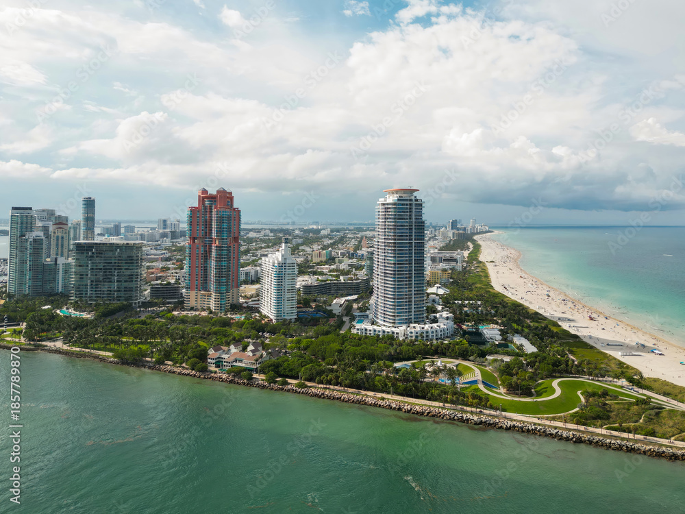 Obraz premium Top view of South Miami Beach. Scenic drone view of Miamis famous coastline. Miami Beach skyline with skyscrapers. Aerial view of Miami Beach in summer. Miami Beach shore with skyscrapers.