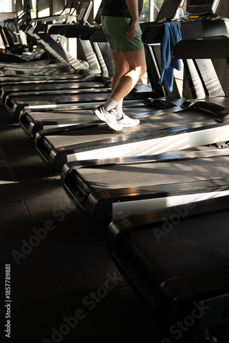 Treadmill Rows with Man Running Legs Close Up