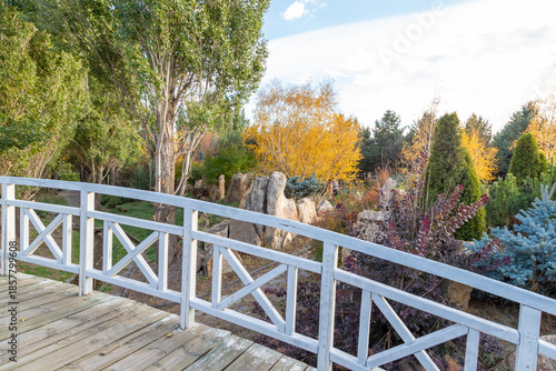 White bridge side in botanic garden during autumn