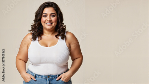 Plus size woman smiling while standing in casual outfit  