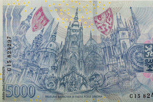 Photos Detailed view of the Czech 5000 Korun banknote featuring intricate blue-hued architectural illustration of Prague Castle, complete with iconic towers, shields, and decorative elements, Czech Republic