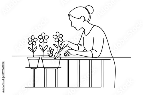 Woman tending to potted flowers on a balcony with a small trowel in her hand