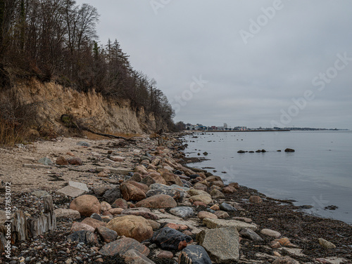 Steep coast with beach and rocks in the water