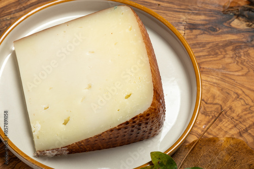 Canvas Print Piece of hard matured Italian cheese pecorino made from sheep's milk