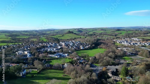 Dartington, South Devon, England: DRONE VIEWS: The village of Dartington with distant views of Dartmoor National Park in the background. To the west of Dartington is the River Dart and Dartington Hall