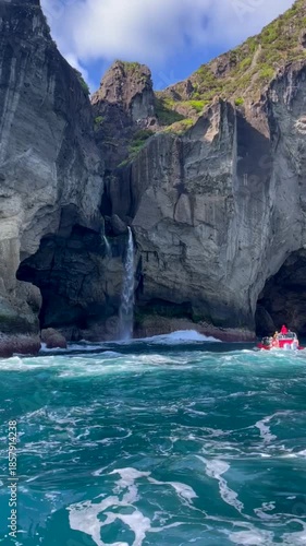 Flores seashore caves with waterfall