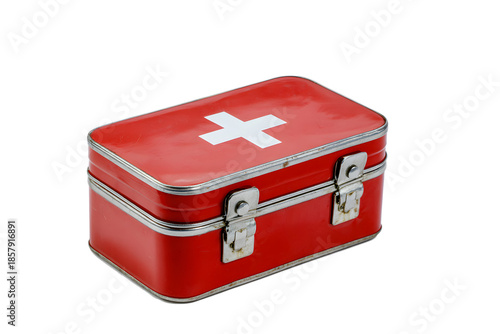 Metal first aid box with a red exterior and white cross design on top placed on a white background for emergency supplies