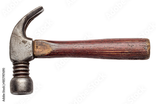 Rusty hammer resting on wooden surface with worn handle and metal head