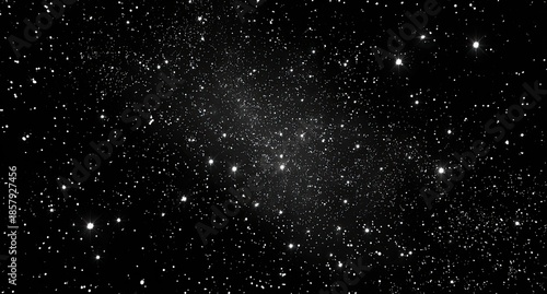 Distant galaxy glows, stars speckle the vast darkness of space