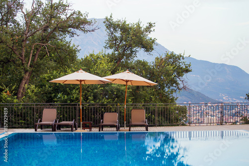 Chairs and umbrella at the swimming pool