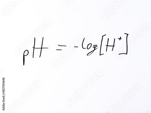 Minimal handwritten formula “pH = –log[H⁺]” defining the pH scale as the negative logarithm of hydrogen ion concentration.