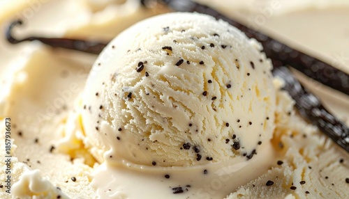 Creamy vanilla bean ice cream with visible flecks and vanilla pods
