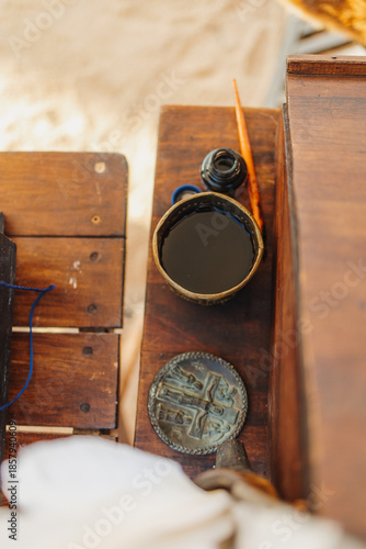 Vintage medieval writing desk with quill pen and ink