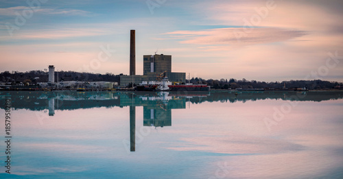 фотографія Long Wharf Pier industrial seascape with a factory chimney and warm water reflec