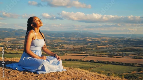 Wallpaper Mural Peaceful woman meditating on mountain top at sunset. Torontodigital.ca