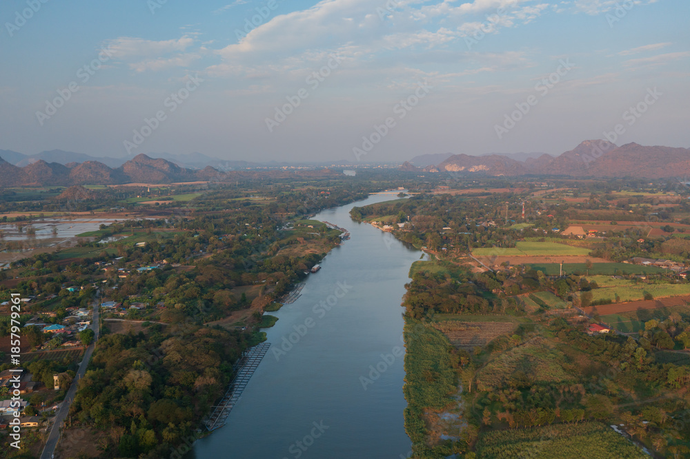 Fototapeta premium Aerial view from a drone of misty morning over the Kwai river in Kanchanaburi, Thailand