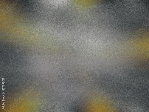 A blurry image of a grey and yellow surface with a few specks of gold