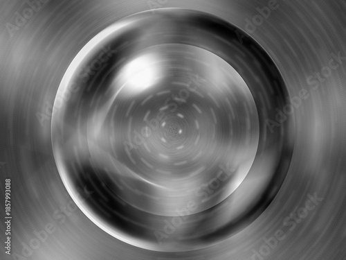 A blurry image of a silver sphere with a dark center