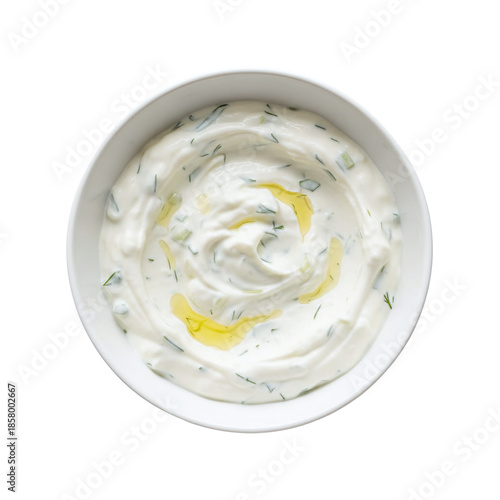 Bowl of tzatziki yogurt dip with herbs and oil