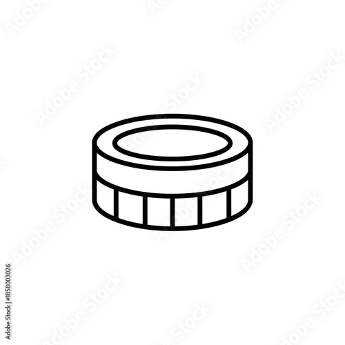 Close-up of a white hockey puck on ice rink surface for sports and game themes