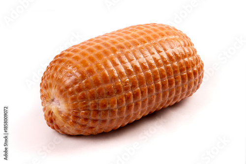 A whole cooked boneless mini ham isolated on white