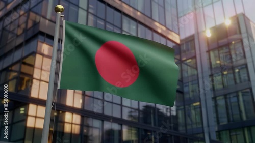 Bangladesh flag waving in front of modern office building
