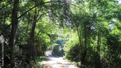 Aerial video view from a high mountain overlooking a beautiful tourist attraction in Lampang, Thailand Wat Chalerm Phra Kiat (Wat Phra Phutthabat Sutthawas),featuring an ancient pagoda and a nature.