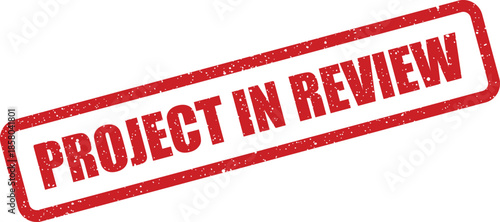 Red distressed rubber stamp indicating a project is currently under review, representing a critical evaluation stage