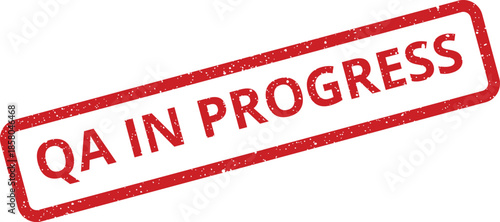 Textured rectangular quality assurance in progress stamp indicating ongoing testing or active inspection