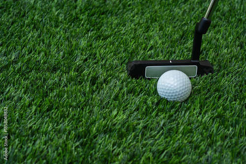Golfer putter direction to the hole on the green