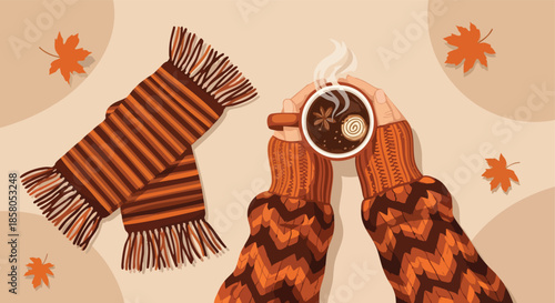 Cozy autumn beverage and warm scarf held by hands wearing knitted sweaters on a neutral background with falling leaves