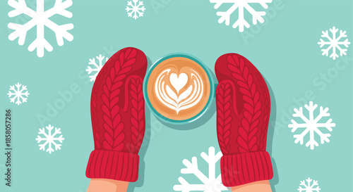 Cozy winter scene of hands in red mittens holding a latte with delicate art surrounded by snow flakes on a light blue background celebrating the joy