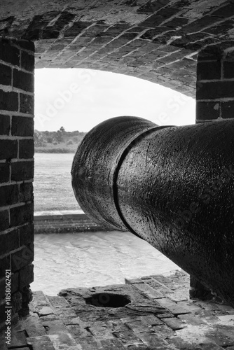 Photography Fort Pulaski: Historic cannon points seaward from brick embrasure