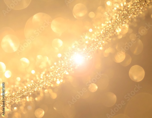 Abstract golden bokeh effect with glittery stream and lens flare