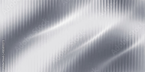 Shiny brushed silver metal texture with a polished stainless steel pattern and industrial gray aluminum surface design for a sleek metallic backdrop