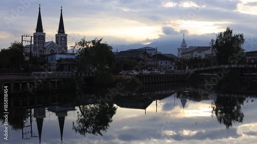 This waterfront video view in a riverside community in Chanthaburi shows the lights and houses along the water, as well as a Christian church – a beautiful tourist attraction in Thailand.